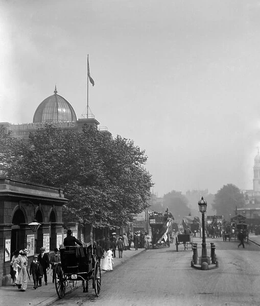 Edwardian London. Busy pavements full of people outside Madame Tussauds waxwork