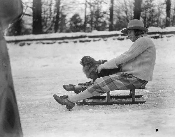 Englands Winter Playground at Buxton, Derbyshire. A lucky dog goes for a ride 23
