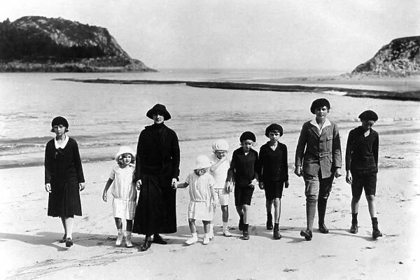 The Ex-Empress of Austria taking her children for a walk on the sands at the Villa Lequeitio