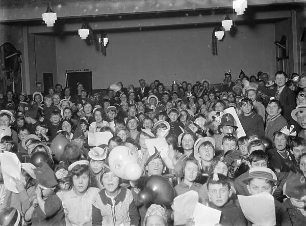 An excited crowd of children at the Swanscombe childrens party. 31 January 1936