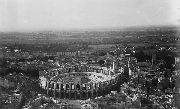 Famous old world town devastated by fire. Historic buildings may be involved. Arles