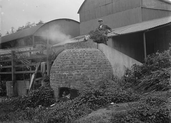 A farmer using his incinerator. 1935