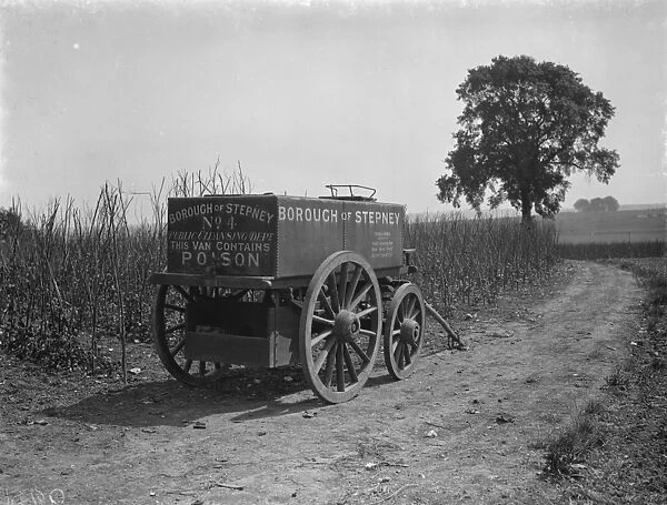 Farmers disinfectant trailer from borough of Stepney at the side of a field