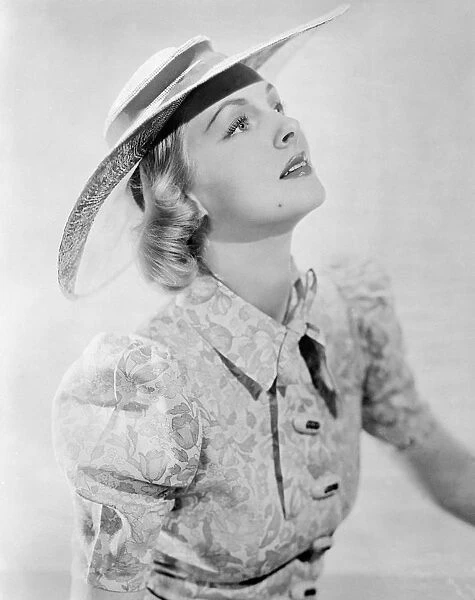Film actress as own hat designer. Photo shows: Miss Orien Hayward, Hollywood film actress