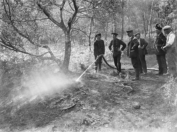 Firemen attempt to put out a fire on Chislehurst Common, Kent. 1939