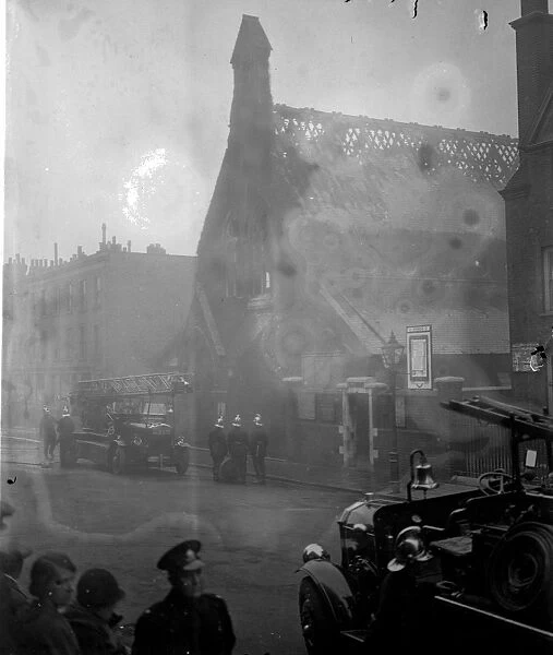 Firemen fight fire at London church. A hundred firemen with twenty engines were