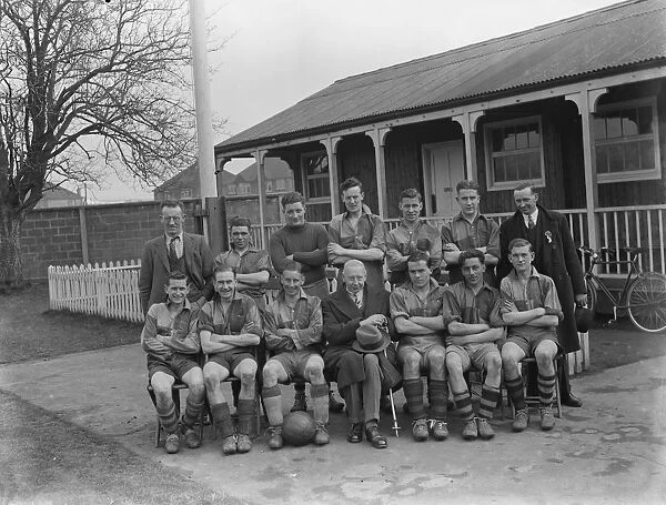 A football team, part of the Kent County Junior Cup, pose for a group photo