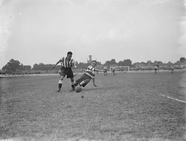 Footballers at Dartford. Two players compete for the ball. 1936