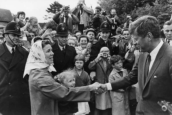 Forest Row, Sussex : A local housewife shakes hands with US President John Kennedy