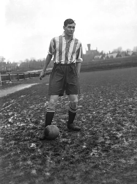 Fred Dell of Dartford Football Club poses with the ball at his feet