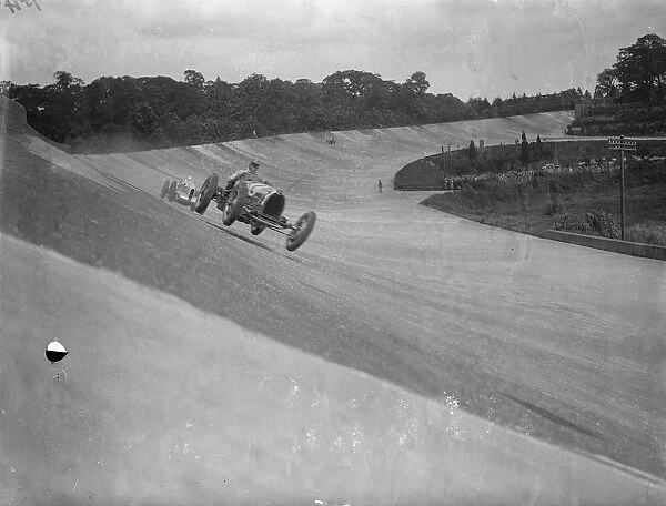 Gold Trophy Race at Brooklands Photo shows : Earl Howe ( Bugatti ) leading Oliver Bertram