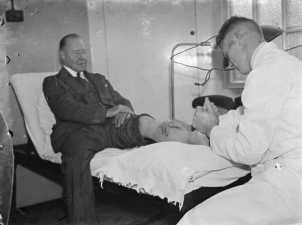 Gravesend hospital series. A patient is given light treatment. 1939