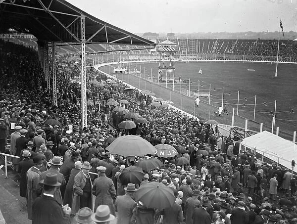 Greyhound race meeting at the White City. A portion of the crowd watching the parade
