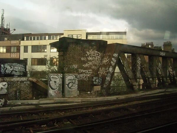 Grim built-up area and landscape of railway architecture with brickwork and bridge