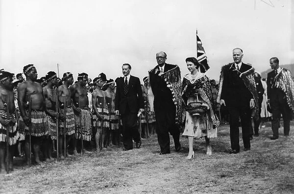 H. M. Queen Elizabeth II and the Duke of Edinburgh passing Maori warriors at Arawa Park