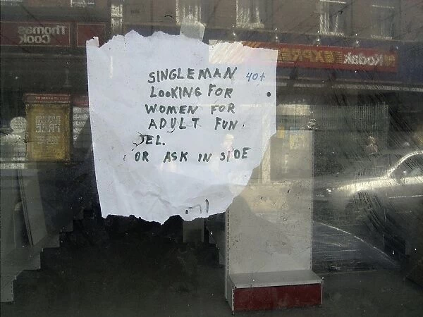 Hand-written notice stuck prominently on display in an empty High Street shop window