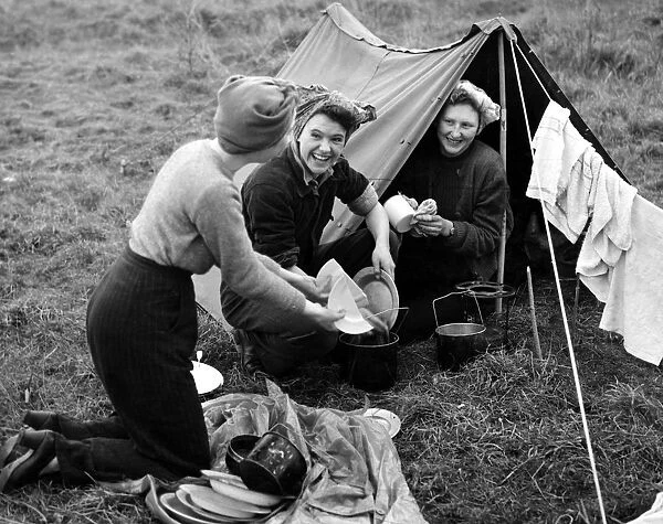 Hardy girls washing up after a meal under canvas at Lullingstone Park, Eynsford, Kent