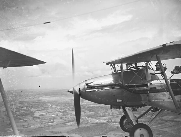 A Hawker Hart of No. 23 Squadron RAF flying in formation over the Medway area in Kent