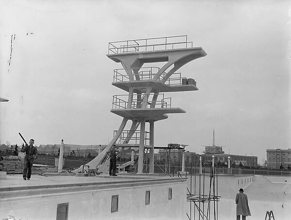 High divers near high flyers. Photo shows: the new high diving stage which has been