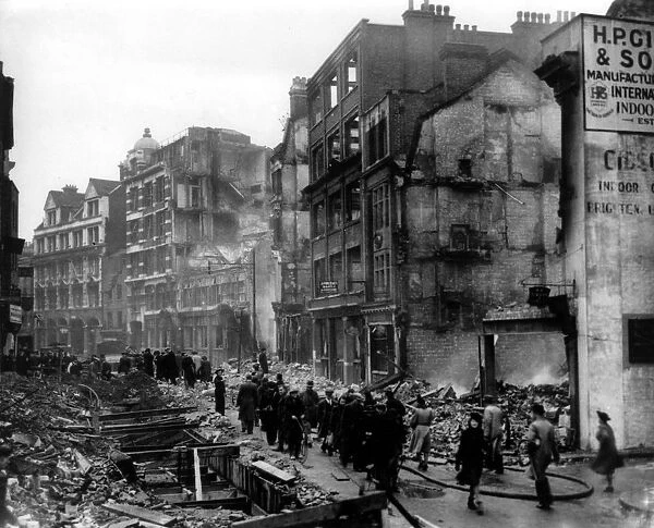 Home front 1940. Showing the destruction caused by German bombing, Brits go about
