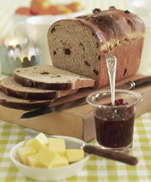 Home made fruited loaf with butter and jam as special breakfast credit: Marie-Louise