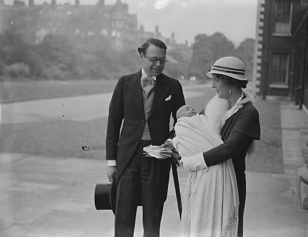 The Hon Lancelot and Mrs Joynson Hicks and their infant son after his christening