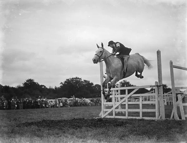 A horse show in Westerham, Kent. The show jumping competition. 1936