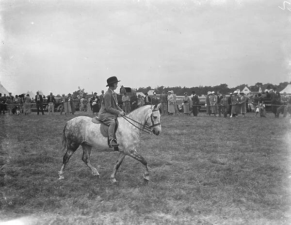 A horse show in Westerham, Kent. Young girl riding a pony. 1936