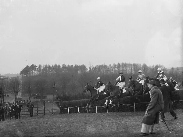 Horses jumping the fences at the R A Woolwich point to point. 1936