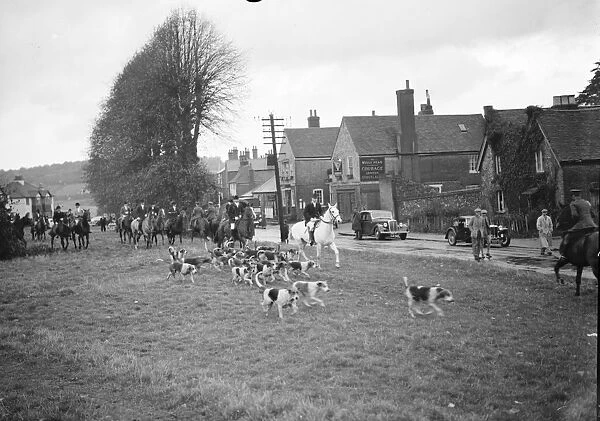 The hunt is off with the hounds chasing the scent. 25 October 1937