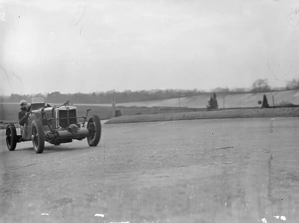 Husband and wife practice at Brooklands for Easter racing. Mrs Roy Eccles was among