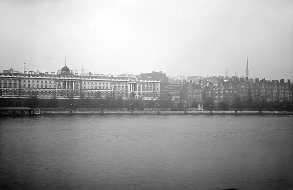 The imposing neoclassical lines of Somerset House viewed from the south bank of the River Thames