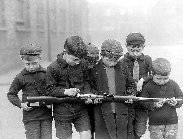 Infants of the Blackhorse Road School, Walthamstow presented with a German rifle