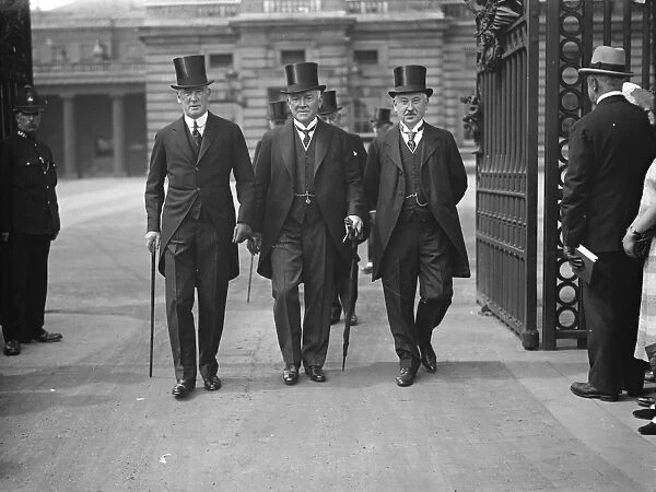 Investiture at Buckingham Palace. Left to right : Sir Colville Smith, Sir David Evans
