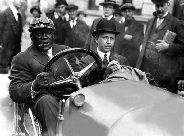 Jack Johnson, the boxer taking a spin in his car