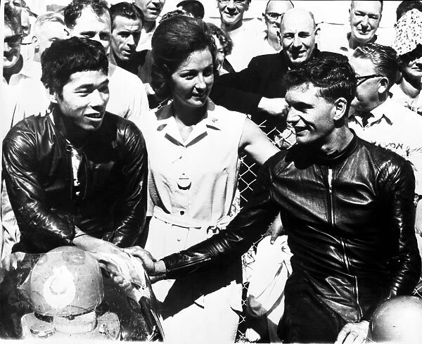 Jim Redman (right), shakes hands with Japans Fumio Ito after winning the 250 cc