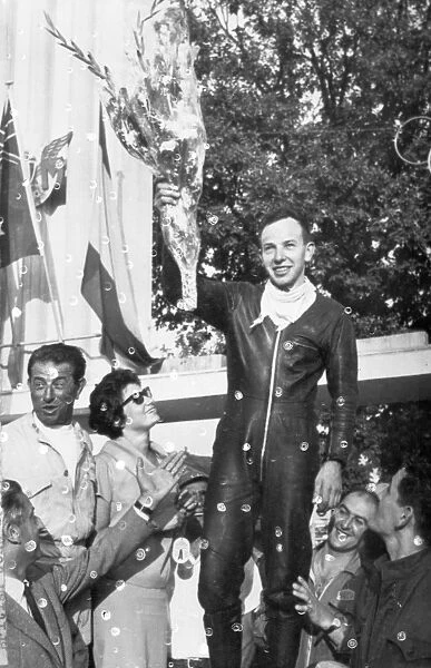 John Surtees acknowledges the cheers of the crowd after his second victory at Monza Italy