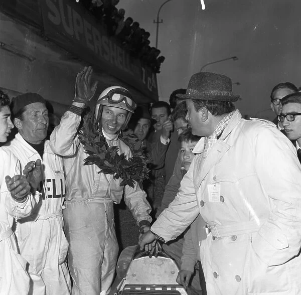 John Surtees garlanded and cheered after his victory in the XIII Grand Prix Siracusa