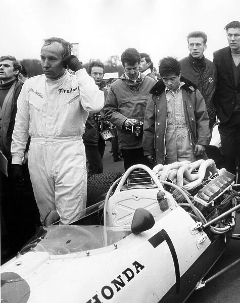 John Surtees leaving his honda after retiring with engine trouble during the Race