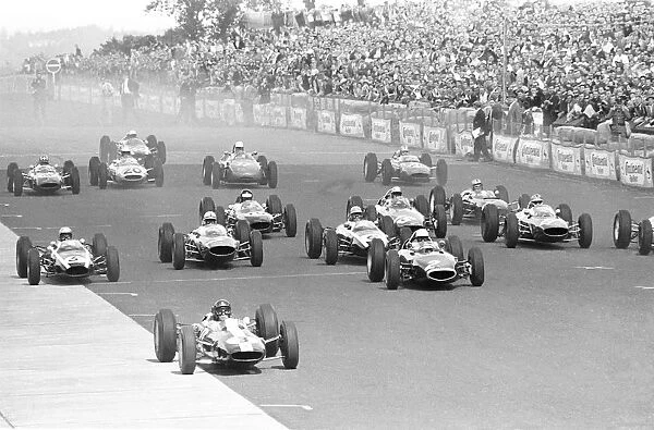 John Surtees storms away at the front of the German Grand Prix Nurburgring which