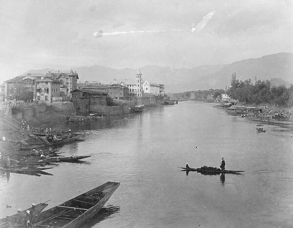Kashmir, India The Jhelum river as it flows through Srinagar, India. 4 December 1924