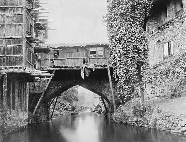 Kashmir, India Srinagar - a quaint bridge on the Marqual canal. 4 December 1924