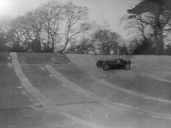Kaye Don speeding around Brooklands track in practice for his duel with Sir Henry Birkin