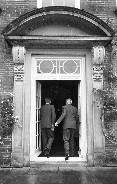 Kennedy and Macmillan entering Birch Grove, Chelwood Gate, Sussex - Macmillans home