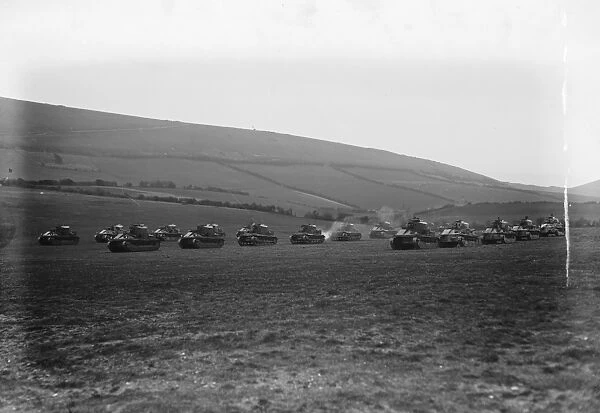 King Amanullah watches mimic tank battle at Lulworth Dorset. Tanks shelling the