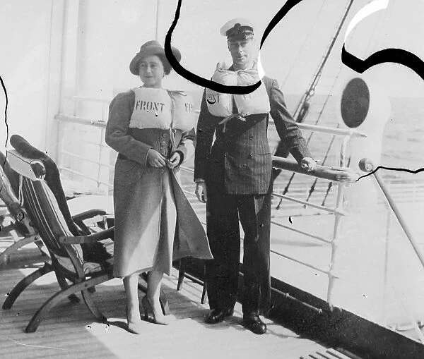 The King and Queen in their lifebelts on the liner Empress of Australia during a lifeboat drill