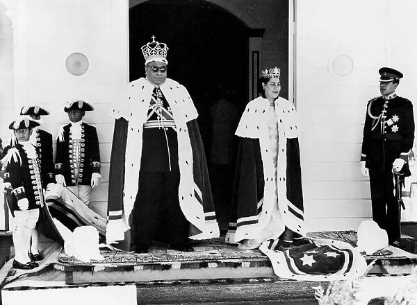 The King and Queen of Tonga, and the Crown Prince attended by their pages, pose