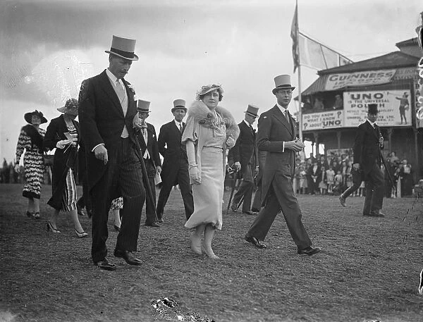 King and Queen walked to the paddock at Epsom on Oaks Day. The King and Queen, paying