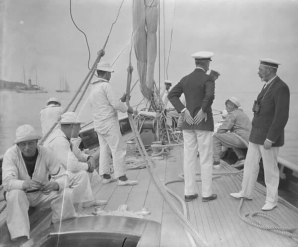 The King takes the wheel of his yacht Britannia. 7 August 1924