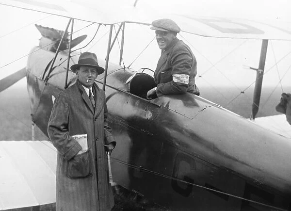 The Kings Cup Air Race. Captain F G M Sparks ( seated ) and Captain Hs Broad ( with cigarette )